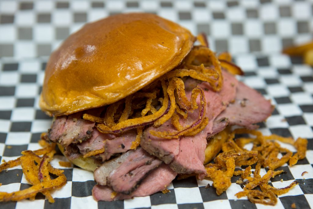 BIG ANGES: Smoked Tri-Tip Sandwich with Crispy Haystack Onions on a toasted Brioche Bun